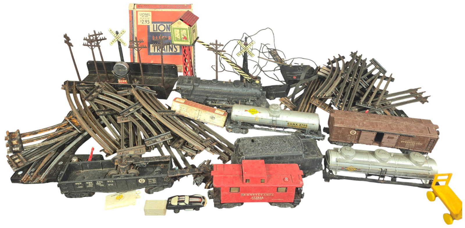 A Large Collection of Vintage Lionel and Marx O Gauge Model Trains and Accessories: This collection of O gauge model railroad equipment includes components from manufacturers Lionel and Marx. The group features a cast metal Lionel 224 2-6-2 steam locomotive accompanied by a black Lio
