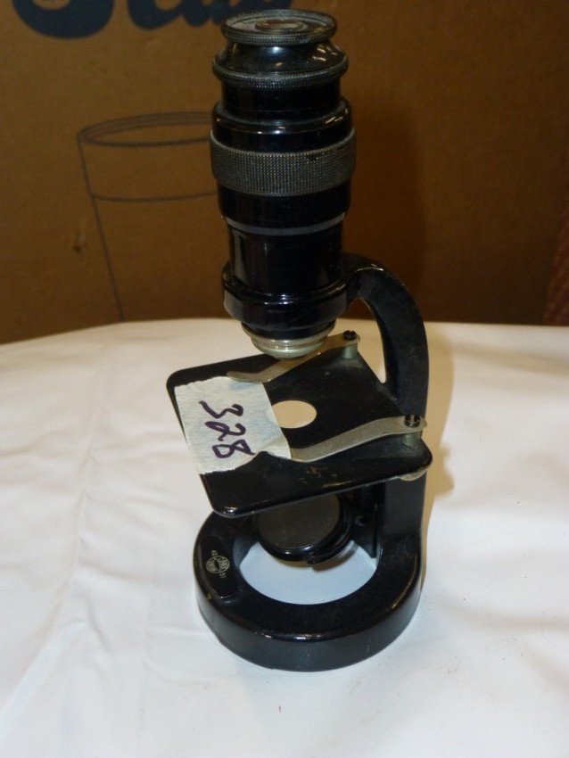 Antique small microscope.: Looks like black paint over brass. Marked C. Baker, London. 6.75" high. Shipping 15.