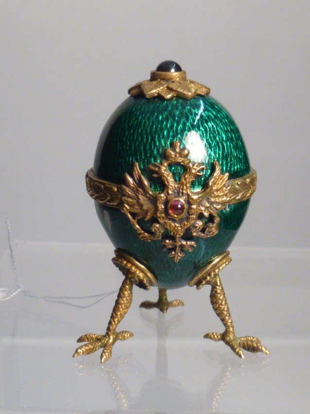 Green enamel w/bird claw feet.: 2" high. Doesn't open. Just an egg. Shipping 7.50.