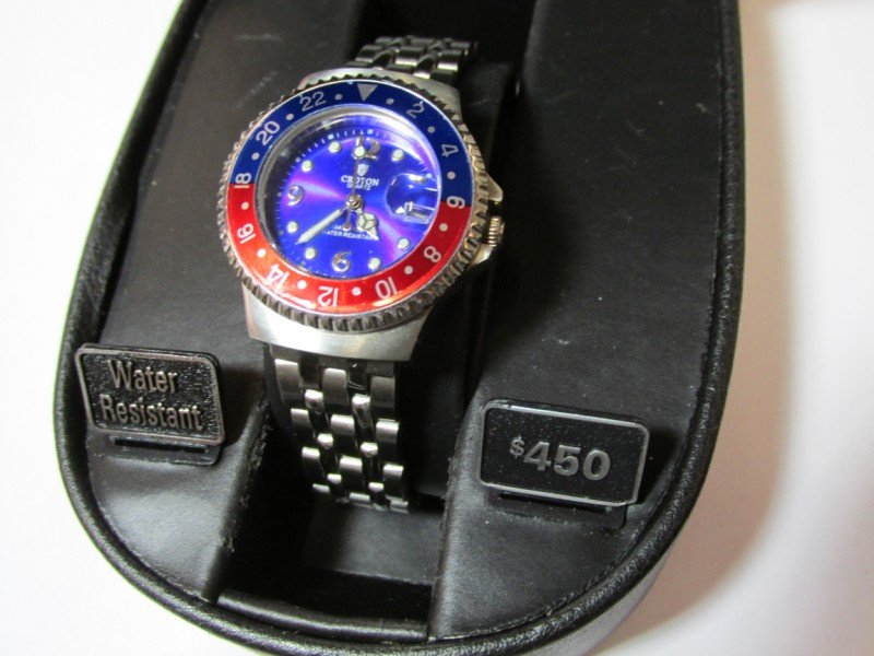 Croton woman's Pepsi Bezel Watch: In box. With date. Shipping 10.