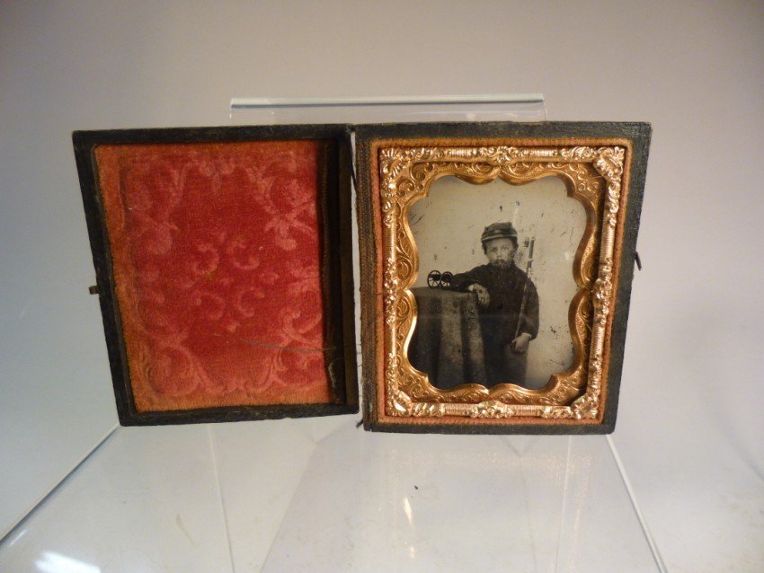 1/9 plate ambrotype Little Boy w/Cannon, Sword: 1/9 plate ambrotype Little Boy w/Cannon, Sword. In a small uniform. Unusual. Shipping 7.50