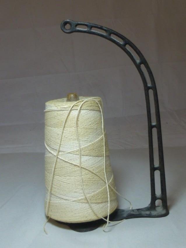 Antique cast iron string holder: 12" tall. Shipping 17.50