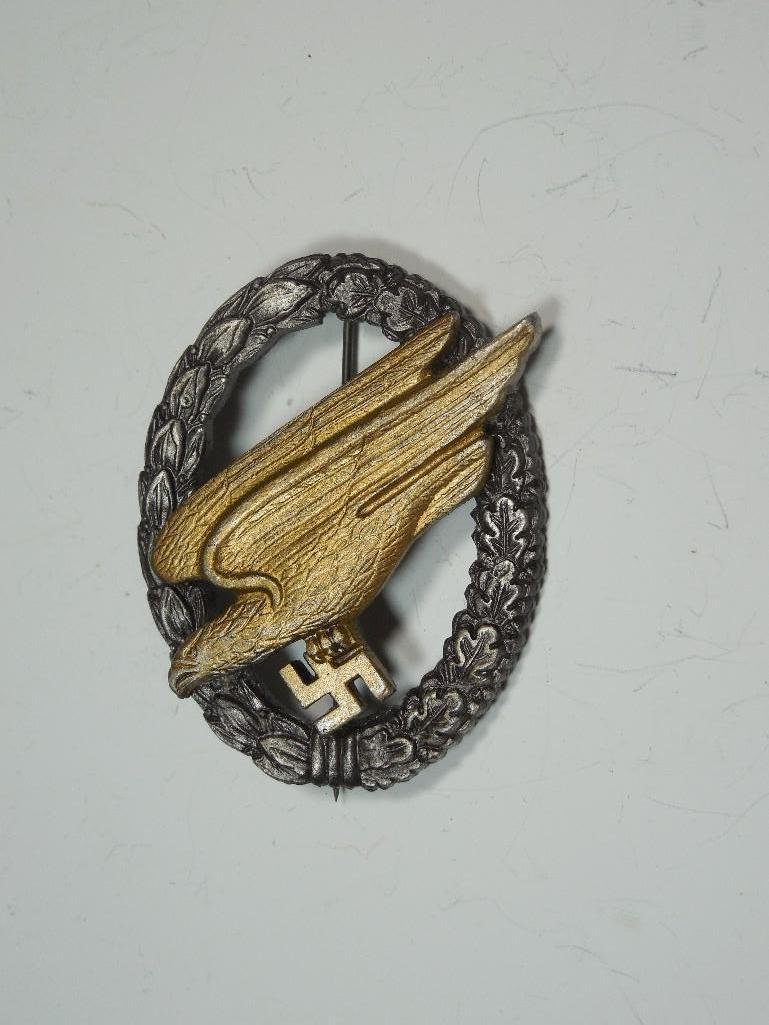 Post WWII German Luftwaffe Parachutist Badge L58: Postwar production of Rudolph Souval, who marked his postwar productions with the small L58, and used these cheap hinges on the pin. He is also known to have manufactured his badges with wires to hold