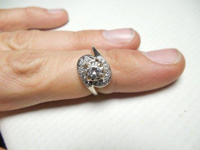 Antique 14k Gold Ring w/1/2 ct Center Diamond: 1/2 carat center stone surrounded by 10 smaller diamonds that are also very clean. A good high quality estate ring. Weight is 3.17 grams. Size is 6 3/4.