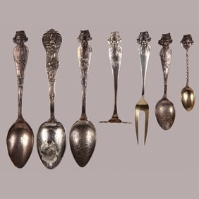 Seven souvenir spoons and other implements, African American Boy