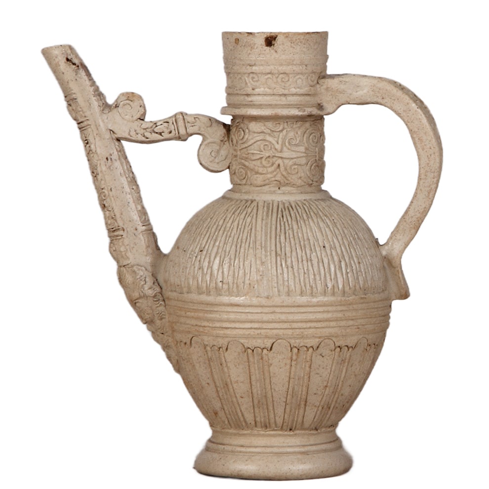 Siegburg Stegkanne, late 1500s: Siegburg Stegkanne, 7.4" ht., late 1500s, applied relief and carved design, a few small upper rim chips, very good condition for over 400 years old.