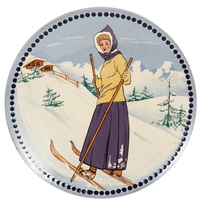 Swiss skiing plaque, 12.0" d., terra cotta, made in Switzerland woman skiing