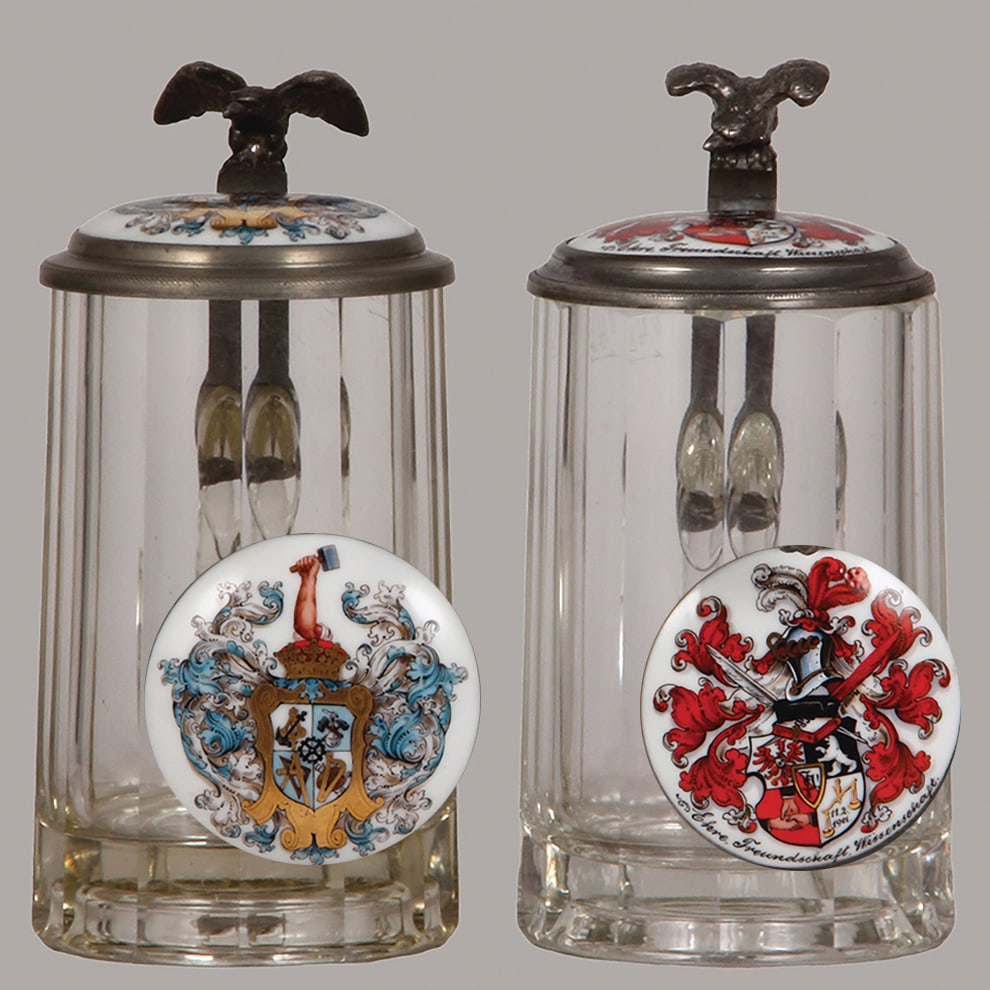 Student steins (two), glass, .4L : Student steins (two), glass, .4L, blown, cut, faceted, porcelain inlaid lids: student society, AV Hütte, Berlin 1903 - 1904; with, unidentified society, 1905, probably Berlin, both mint.