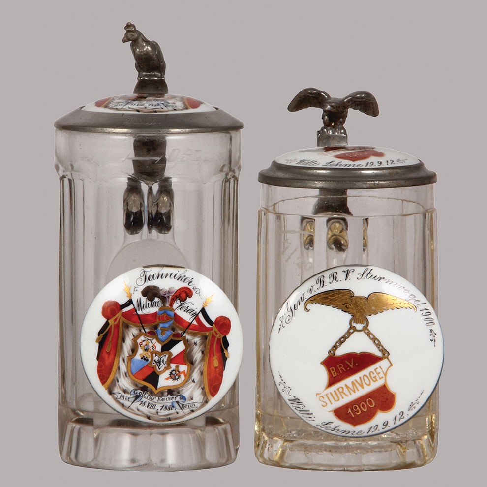 Glass steins, two, .5L, Wilhelm I, & B.R.V. Sturmvogel : Glass steins, two, .5L, pressed, relief Wilhelm I, porcelain inlaid lid: Techniker, Militair Verein, 1886, some wear on the glass; with, .35L, pressed, porcelain inlaid lid: B.R.V. Sturmvogel, 1900, d