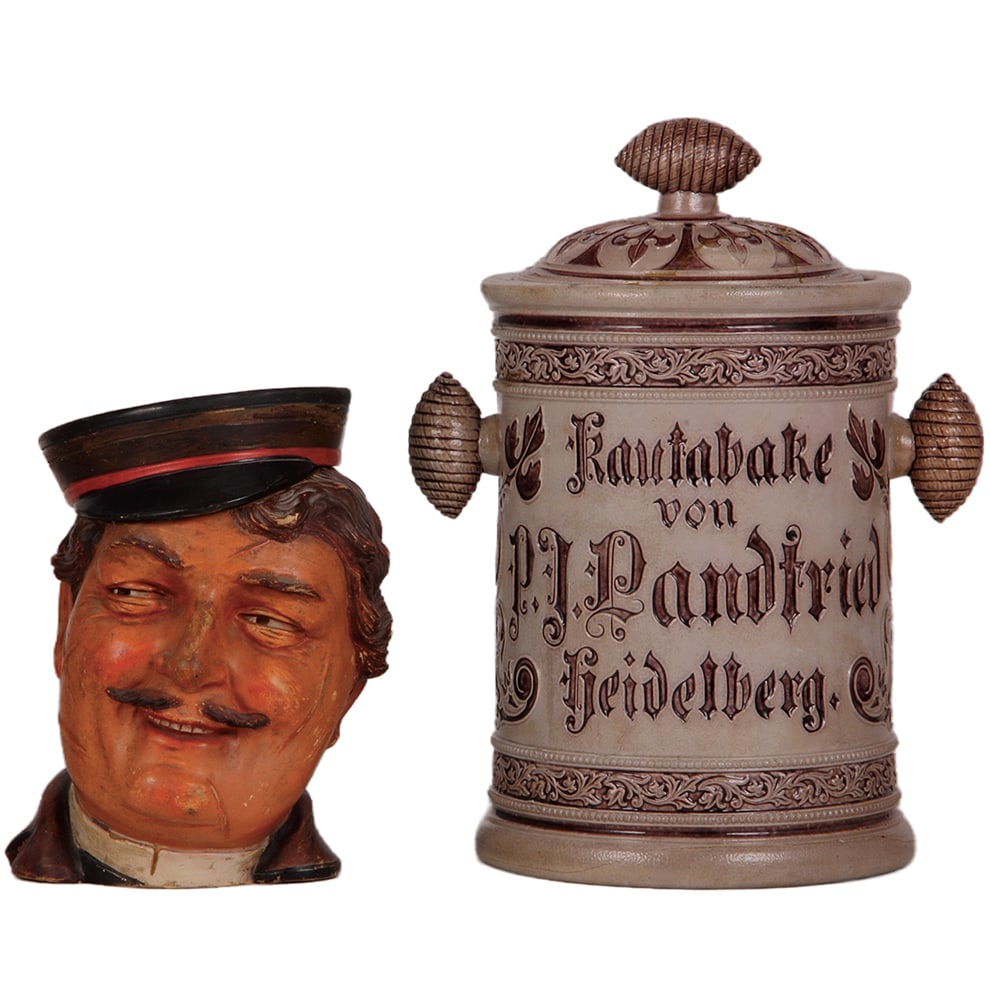 Tobacco humidors, two, 7.5" ht., terra cotta & stoneware : Tobacco humidors, two, 7.5" ht., terra cotta, marked J.M., 3294, by Johan Maresch, Fraternity Student, chip on lid; with, stoneware, 11.3" ht., relief, marked Steinzeugfrabricken, Hofstetter & Kunst H