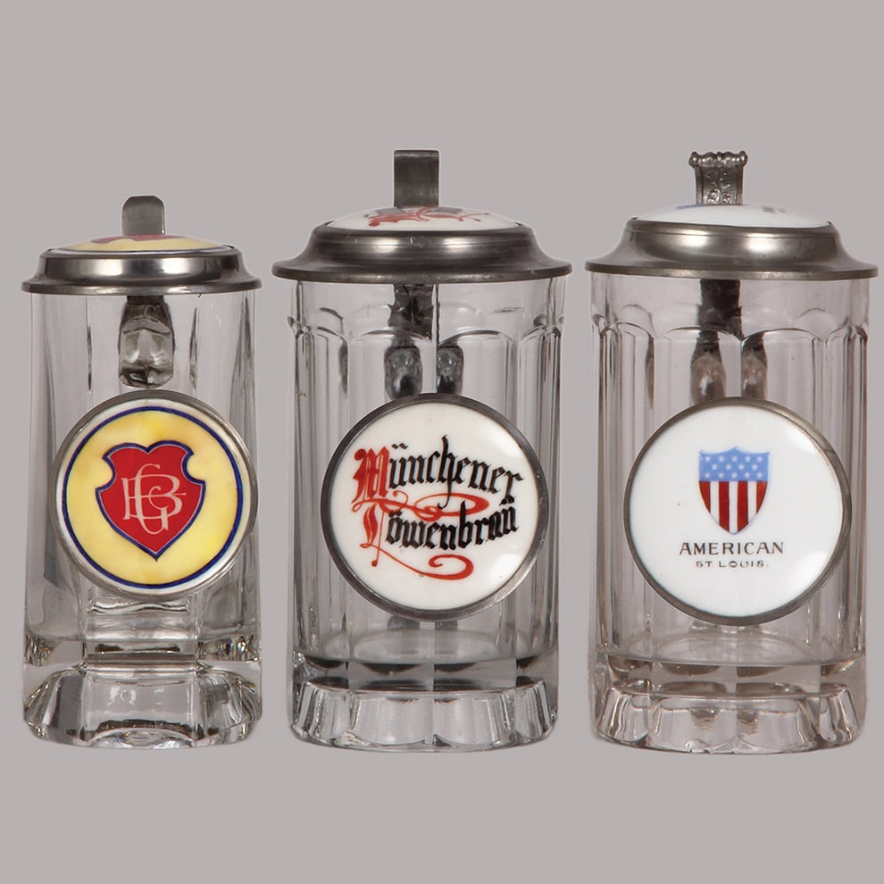 Pre-prohibition brewery steins, three, .3L & .5L, glass : Pre-prohibition brewery steins, three, .3L & .5L, glass, porcelain inlaid lids: GB in shield, Griesdieck Bros., Münchener Löwenbrau, American St. Louis, all mint.