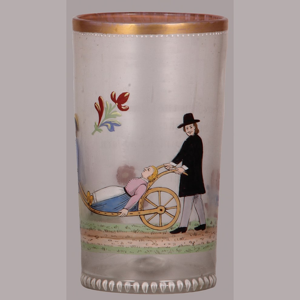 Fritz Heckert glass humpen, 8.1" ht.: Fritz Heckert glass humpen, 8.1" ht., blown, clear, marked F.H. HO 8/5 on underside, historismus late 19th. century version of late 18th. century original, woman being carried off on primitive cart da