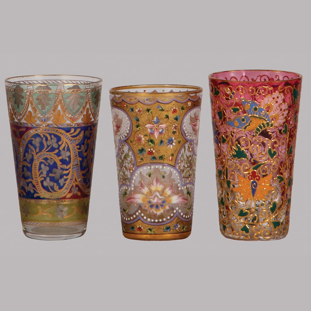 Ludwig Moser & Fritz Heckert glass tumblers, three, 3.5" to 3.9" ht.: Ludwig Moser & Fritz Heckert glass tumblers, three, 3.5" to 3.9" ht., blown, clear, one pink to clear, engraved, by Fritz Heckert, Jodphur designed by Rudolph Willie or Franz Reuleaux 1912, others are