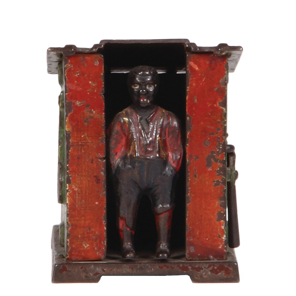 Cast Iron Mechanical Bank, 3.5” ht., Black Boy & Outhouse.: Cast Iron Mechanical Bank, 3.5” ht., 4.4” wide, 3.0” deep, Black Boy & Outhouse, Patent 1885. Refer to the photographs to evaluate the condition, including color wear.