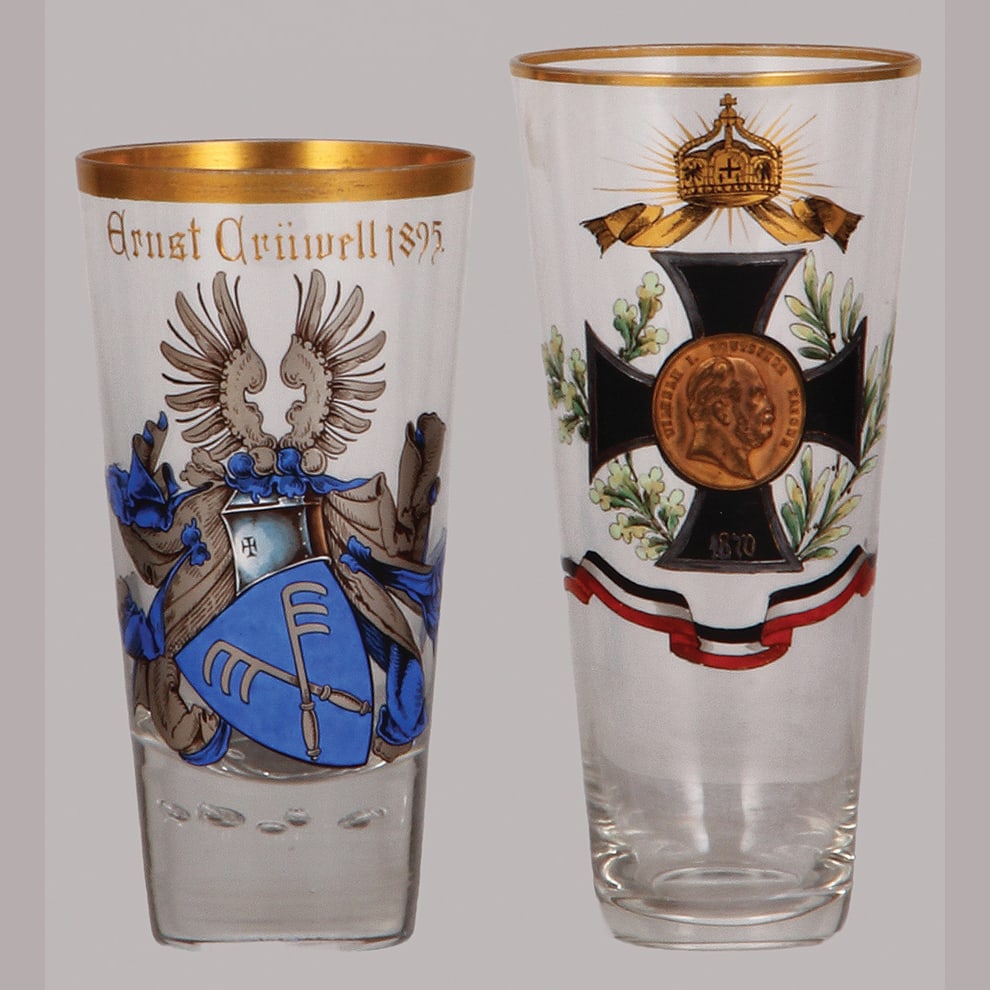 Glass tumblers or beakers, two, 5.5" ht., & 6.2" ht..: Glass tumblers or beakers, two, 5.5" ht., blown, clear, hand-painted, coat-of-arms, Ernst Crüwell 1895, gilding; with, 6.2" ht., blown, clear, hand-painted, Iron Cross 1870, coin shaped center: W