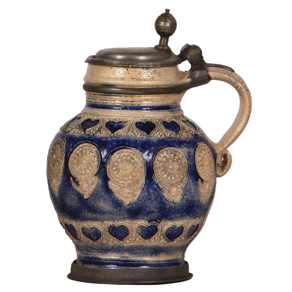 Westerwälder Melonenkrug, 7.8" ht., early 1700s.: Westerwälder Melonenkrug, 7.8" ht., early 1700s, applied relief, blue saltglaze, pewter lid and footring, pewter strap repaired, small factory glaze flaw, otherwise body is in good condition.