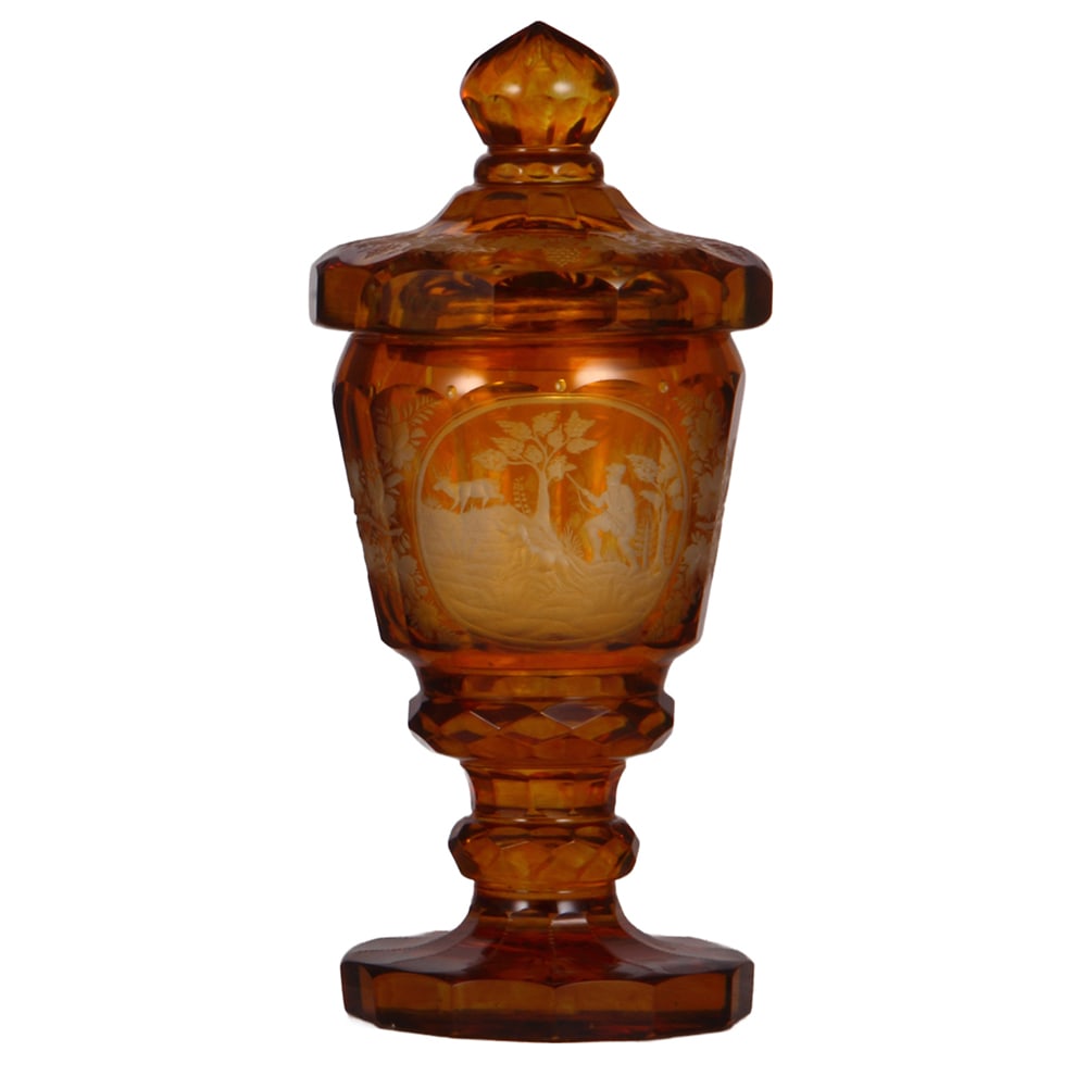 Glass pokal, 12.5" ht., blown, wheel-engraved, hunter with dog.: Glass pokal, 12.5" ht., blown, clear, mid 1900s, amber staining, cut, wheel-engraved, hunter with dog pursuing stag, grape vines around body, matching set-on lid, very heavy, mint.