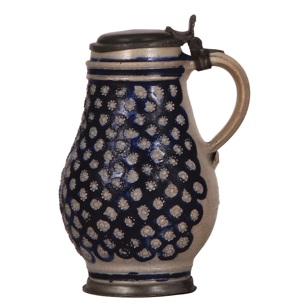 Westerwälder Birnkrug, 9.0'' ht., 1700s.: Westerwälder Birnkrug, 9.0'' ht., 1700s, applied relief, blue saltglaze, pewter lid & footring, very good pewter strap repair, tight hairline on the handle, otherwise body in very good condition.