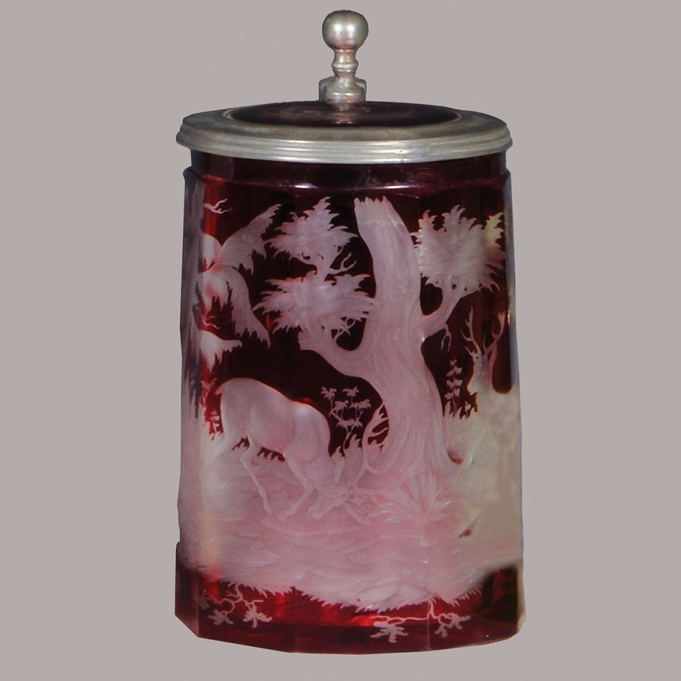 Glass stein, .75L, blown, copper wheel-engraved.: Glass stein, .75L, blown, copper wheel-engraved, red on clear overlay, two stags, glass inlaid lid with engraved stag, very deep & excellent quality engraving, flake on edge of inlay, minor pewter tea