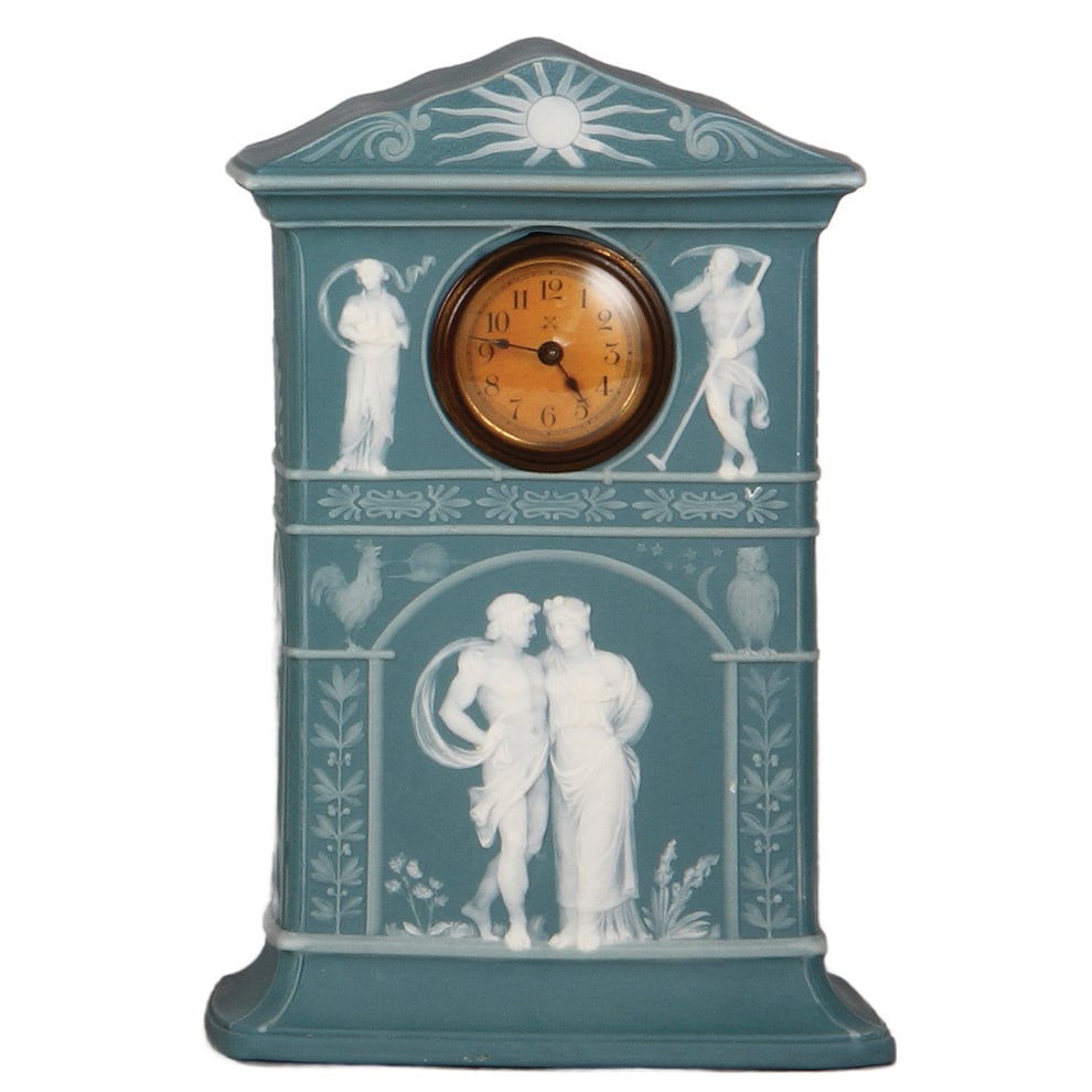Mettlach clock, 10.3" ht., 7034, phanolith.: Mettlach clock, 10.3" ht., 7034, phanolith, 1" factory firing line near face of clock at 1:00, clock mechanism not guaranteed to work, body is mint.