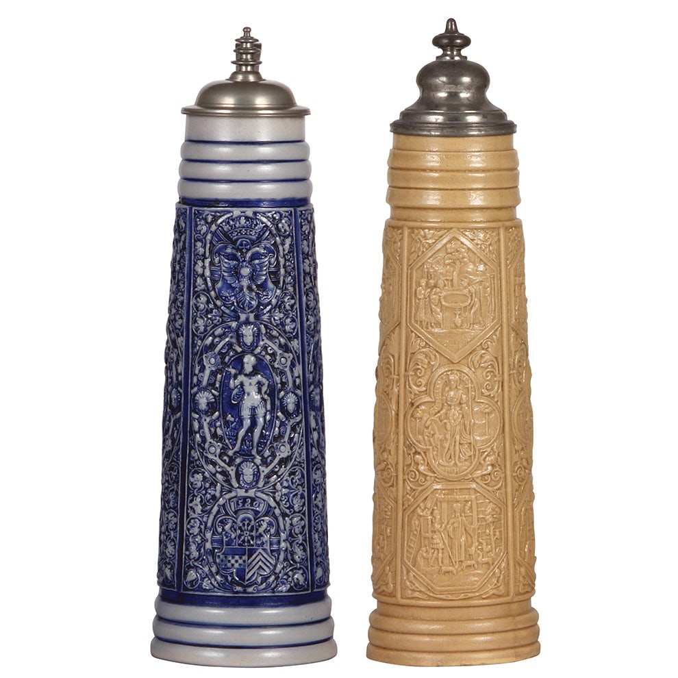 Stoneware steins, two, 1.2L, made c.1900.: Stoneware steins, two, 1.2L, 13.5" ht., relief, marked M. & W. Gr., made c.1900, Siegburg Schnelle, with 1580 date, pewter lid, blue saltglaze, excellent example, mint; with, 1.5L, 15.5" ht., relief, 
