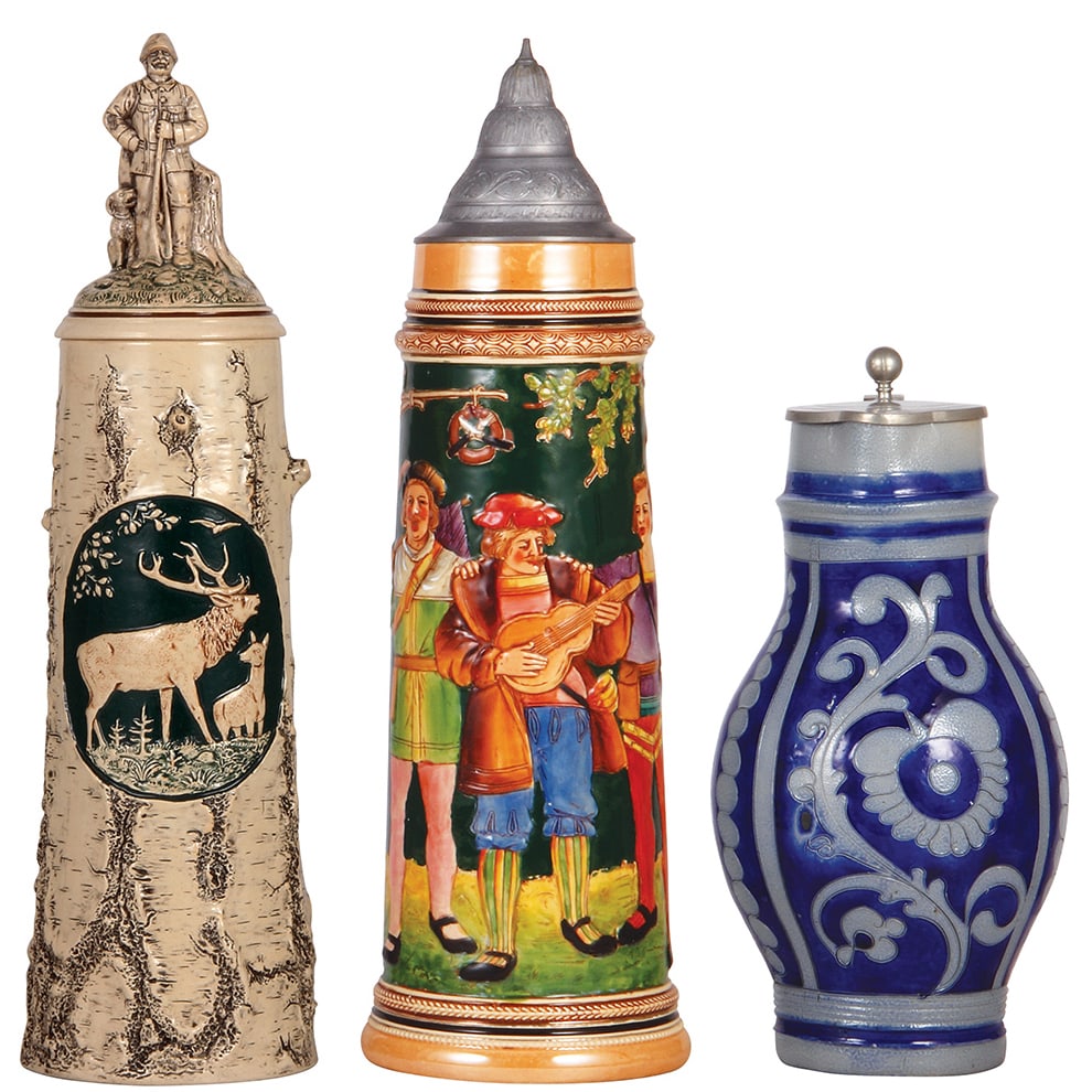 Pottery & stoneware steins, three.: Pottery & stoneware steins, three, 18.2'' ht., pottery, relief, 1636, by Reinhold Hanke, Elk, figural lid, neck of finial (man) is glued and small chip next to pewter; with, 15.8" ht., pottery, relief