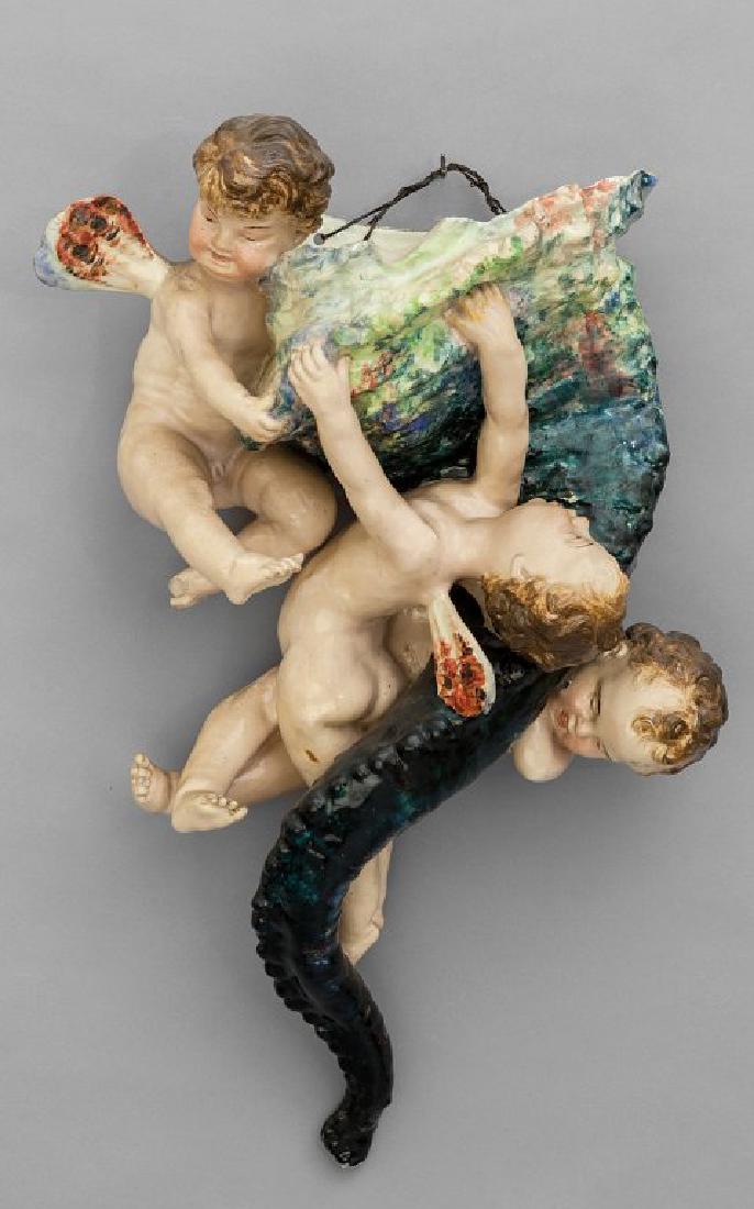 Tre putti che sorreggono una cornucopia,: Tre putti che sorreggono una cornucopia, portafiori in ceramica policroma inizi sec.XX (piccoli difetti) cm. 38x20 h. 60
