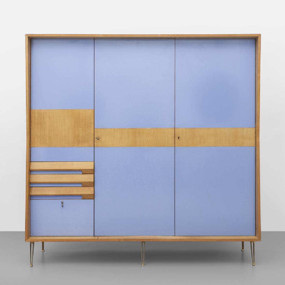 UN ARMADIO, anni '50.  Legno impiallacciato in (1 of 2)