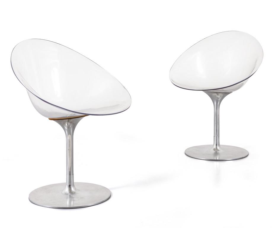 PHILIPPE STARCK Due poltroncine girevoli: PHILIPPE STARCK Due poltroncine girevoli modello 'Eros' per KARTELL, anni '90. Alluminio lucidato, policarbonato. Marcata. Altezza cm 80, larghezza 60, profonditÃ 60.