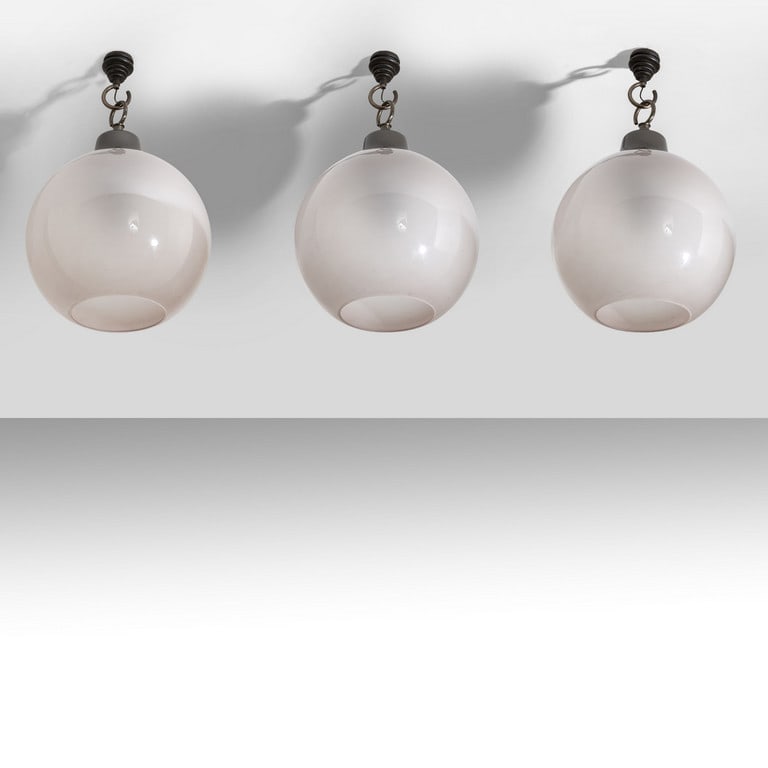 LUIGI CACCIA DOMINIONI, AZUCENA, 1964. Tre: LUIGI CACCIA DOMINIONI, AZUCENA, 1964. Tre lampade a sospensione 'Ls 10' ('Boccia'). Alluminio anodizzato, ottone brunito, cristallo satinato internamente. Diametro del diffusore cm 40. A set of three