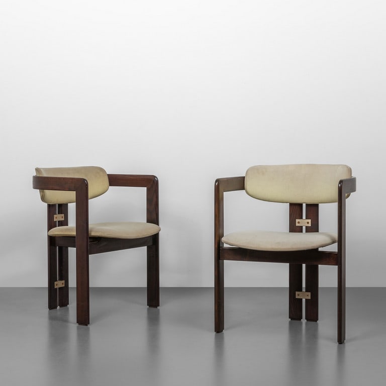 AUGUSTO SAVINI, POZZI, circa1970. Due: AUGUSTO SAVINI, POZZI, circa1970. Due poltroncine 'Pamplona'. Legno di rovere tinto all'anilina, sedili e schienali imbottiti rivestiti in tessuto. Altezza cm 74, larghezza 57, profondità 51. A pair