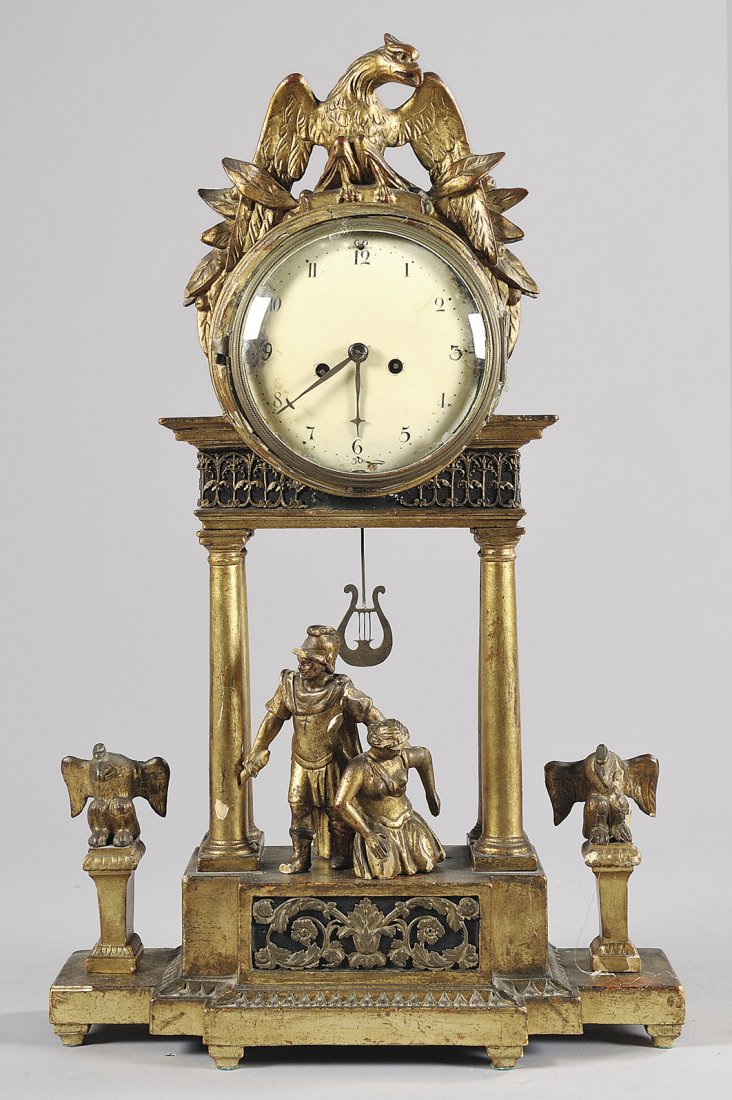 Pendola in legno intagliato e dorato, Vienna : Pendola in legno intagliato e dorato, Vienna inizi sec.XIX (difetti) cm. 36x11,5 h. 58