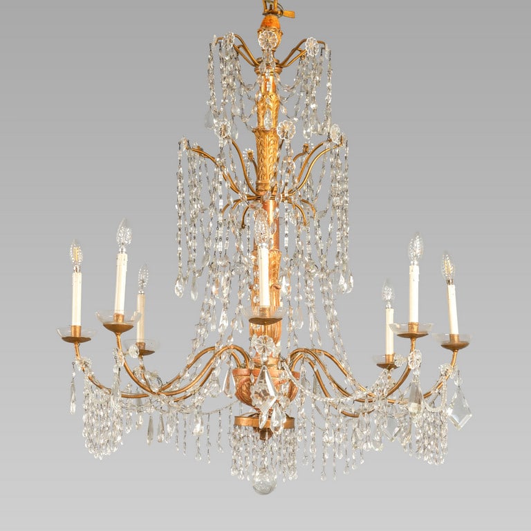 Lampadario Luigi XVI a otto luci, fusto e: Lampadario Luigi XVI a otto luci, fusto e bobeches in legno intagliato e dorato, decorazione in cristallo, Genova fine sec.XVIII diam.cm.113xh.80