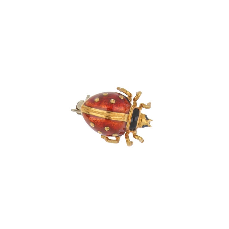 Spilla a coccinella portafortuna, in oro giallo e: Spilla a coccinella portafortuna, in oro giallo e smalti. Dimensioni 2 x 1,5 cm. Peso 2,97 g.