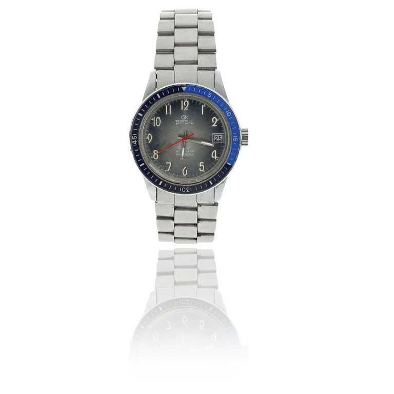 BREIL - Orologio professionale in acciaio con: BREIL - Orologio professionale in acciaio con bracciale, quadrante a numeri arabi di colore azzurro cangiante e sfumato, secondi al centro e datario a ore 3. Movimento meccanico a caricaautomatica, da