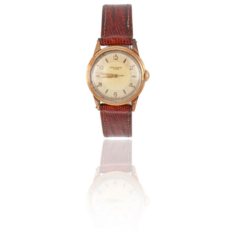 MOVADO, orologio per signora in acciaio, modello: MOVADO, orologio per signora in acciaio, modello Sport, movimento meccanico a carica manuale, quadrante dorè con indici a numeri arabi alternati a barretta, lunetta dorata, cinturino in pelle man