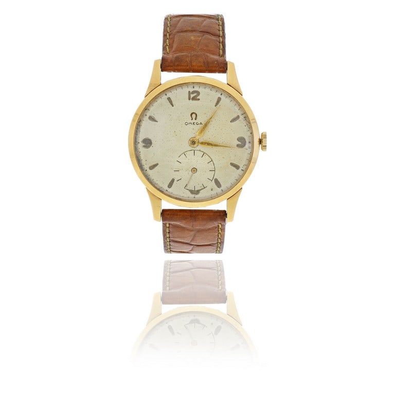 OMEGA - Orologio da uomo in oro giallo, senza: OMEGA - Orologio da uomo in oro giallo, senza fibbia originale, quadrante argente', indici a cuneo e numeri arabi, movimento meccanico a carica manuale, piccoli secondi a ore 6. Diametro 36 mm, si con