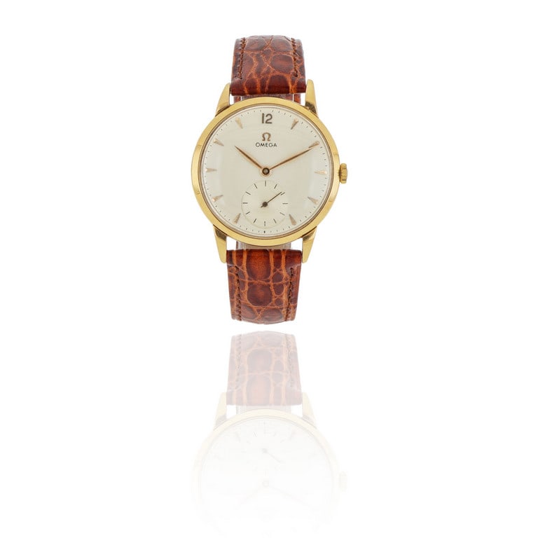 OMEGA Orologio in oro giallo animato da movimento: OMEGA Orologio in oro giallo animato da movimento meccanico a carica manuale, funzione solo tempo con piccoli secondi ad ore 6, quadrante crema con indici cuneiformi, sfere oro leaf, fondello a pressi
