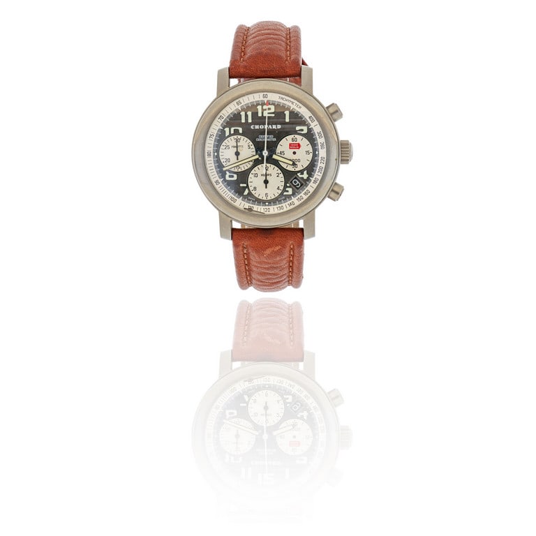 CHOPARD - Orologio da uomo in titanio modello: CHOPARD - Orologio da uomo in titanio modello "Millemiglia", con cinturino in pelle, fibbia non originale, animato da movimento a carica automatica visibile attraverso il vetro zaffiro del fondello.