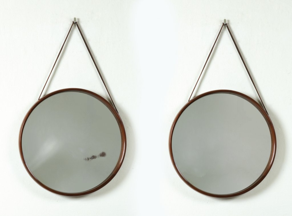DUE SPECCHI DA PARETE, circa 1960. Cornici in : DUE SPECCHI DA PARETE, circa 1960. Cornici in legno di teak. Diametro cm 51,5.
