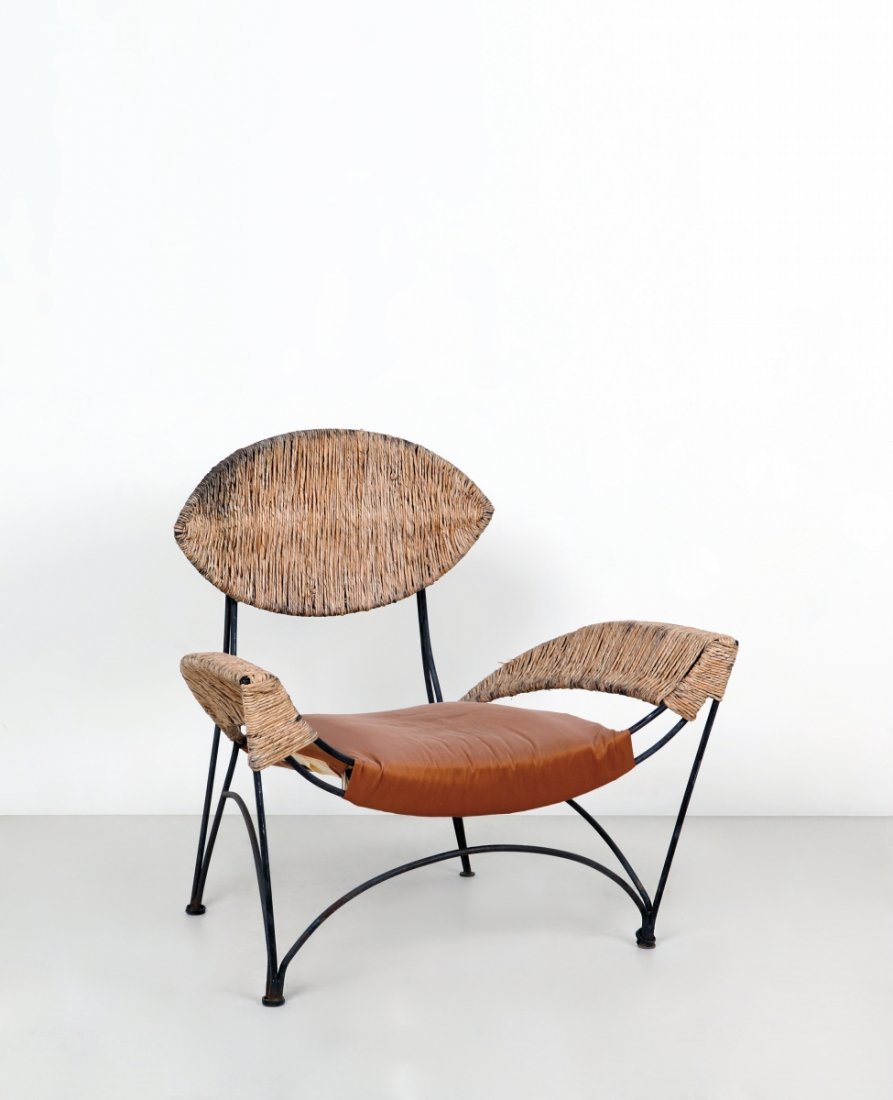 TOM DIXON Una poltrona ¿Fat Chair¿ per: TOM DIXON Una poltrona ¿Fat Chair¿ per CAPPELLINI INTERNATIONAL, 1991. Tondino di ferro verniciato, paglia intrecciata. Altezza cm 91, larghezza 93, profondità 75. Letteratura: Giuliana Gramigna, R
