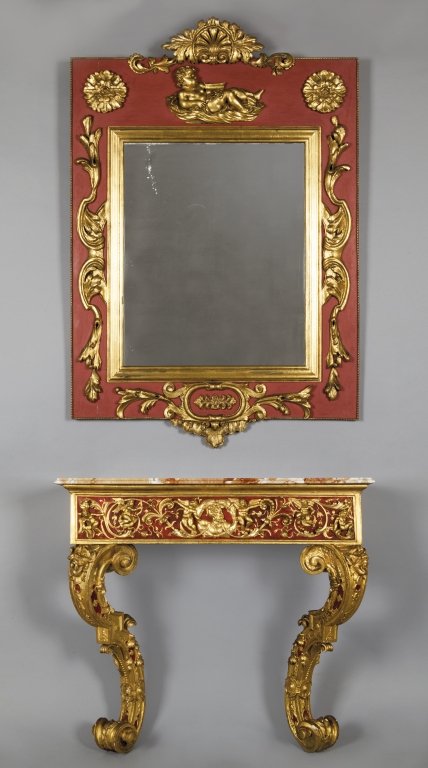 Console a due gambe con specchiera in legno: Console a due gambe con specchiera in legno intagliato, laccato rosso e dorato con putti festanti, piano in marmo console cm.106x36xh.96 specchiera h.cm.134