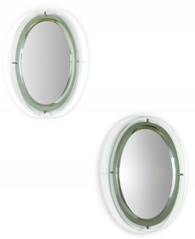 DUE SPECCHI DA PARETE, anni Â’60. Cristallo: DUE SPECCHI DA PARETE, anni Â’60. Cristallo molato, cristallo argentato, ottone cromato Cm 80 x 57. A pair of wall mirrors, 1960Â’s. Bevelled crystal, mirrored crystal, chrome plated brass, and 