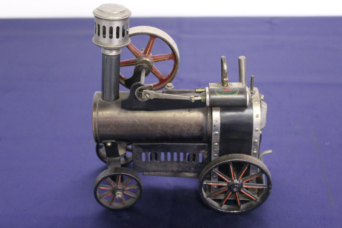 19th Century DC Made in Germany Steam Engine Scale: 19th Century DC Made in Germany Steam Engine Scale Model. One wheel loose. 3.5"W x 6.5"L x 7.5"H