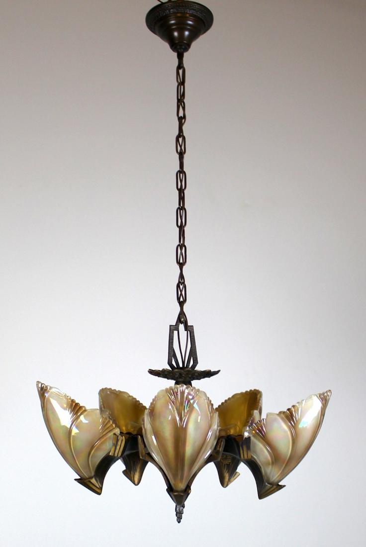 5 light Art Deco 'Bat Wing' Fixture: Striking 'Bat Wing' Art Deco Fixture. C.1930, This piece boasts its original finish + 5 beautiful Clam Shell Slip Shades. Meas: 35"L x 19"D