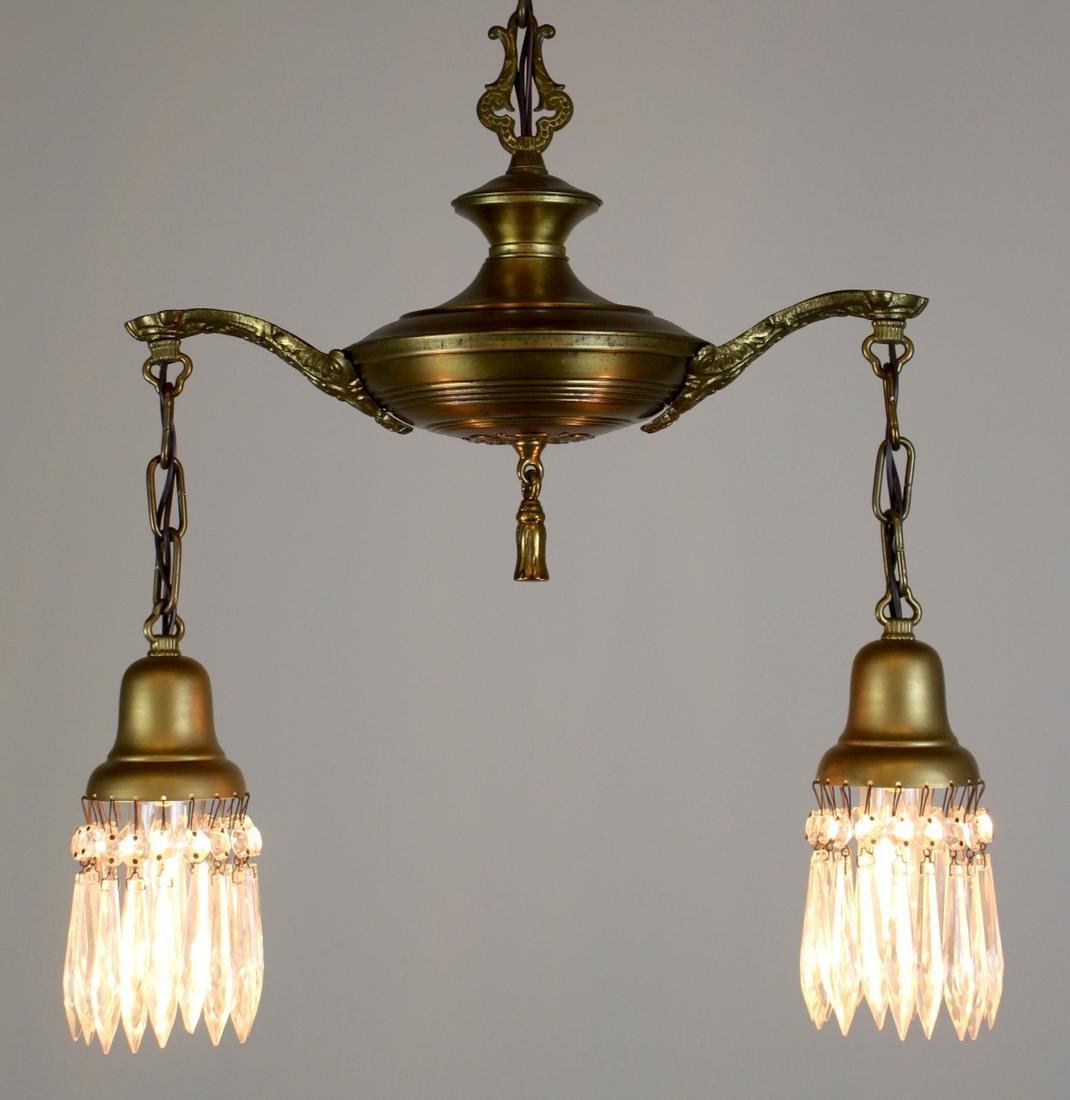 2 light Colonial Revival Style Pan Fixture: Charming little 2 light Pan Fixture, in the Colonial Revival Style. Fitted with Prisms and finished in Lacquered old Brass colour. C. 1925 Meas: 41"L x 16"D