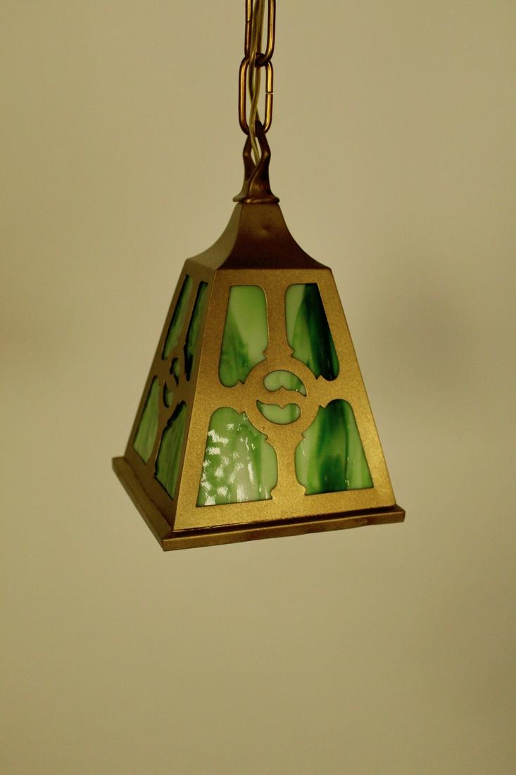 Arts and Crafts Pendant with Green Slag Glass: Arts and Crafts pendant fixture on chain with green slag glass in cutout shades. Circa 1915 Measures 39"H x 7"D