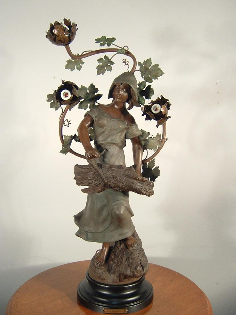 C. 1910 French Figural Lamp: Ca. 1910 French figural newel post style lamp, made of spelter and fully restored. Marked 'Botteleuse, par Rousseau' with the Paris, France foundry seal on the back. This figure wears a green hooded c