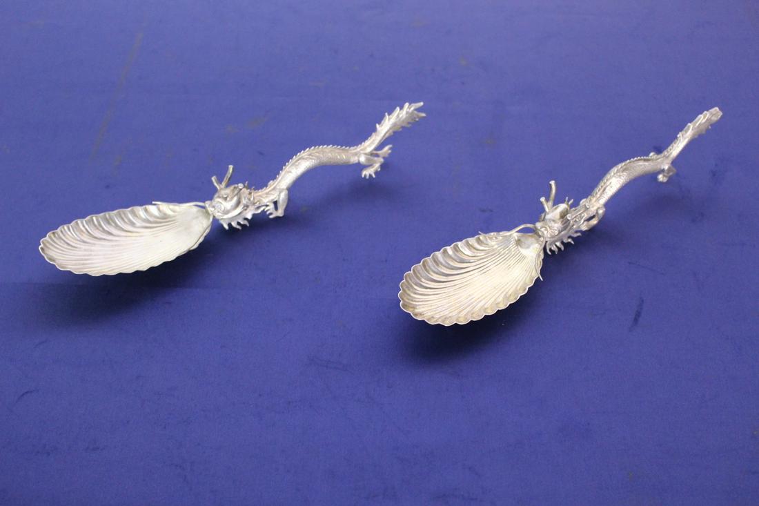C. 1900 Matched Pair of Chinese Silver Spoons: C. 1900 Matched Pair of Chinese Silver Spoons. Dragon shaped. Circa 1850. 9.5"L x 2"W.