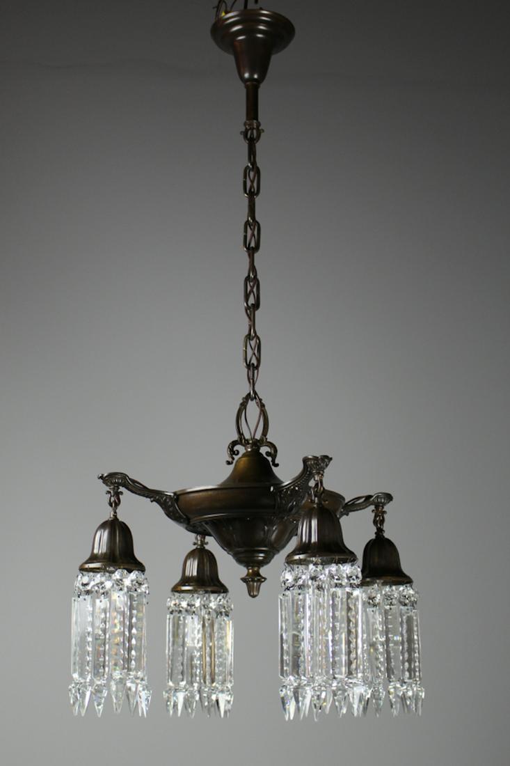 C. 1925 After Sunset Crystal 4Light Fixture: Circa 1925 Pan fixture made by Lightollier's "After Sunset" collection. A darling light fitted with notched crystal and Sheffieldstyle hooked arms in a deep bronze finish. Rewired and ready to hang. M